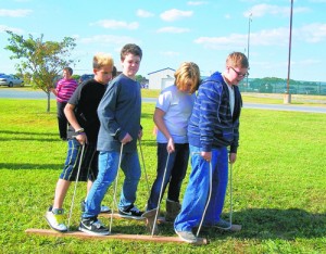 Junior ROTC Leadership Academy Demonstrate Activity That Requires Teamwork